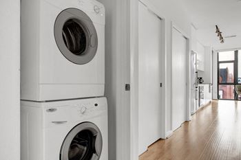 A front loading washer and dryer in a laundry room